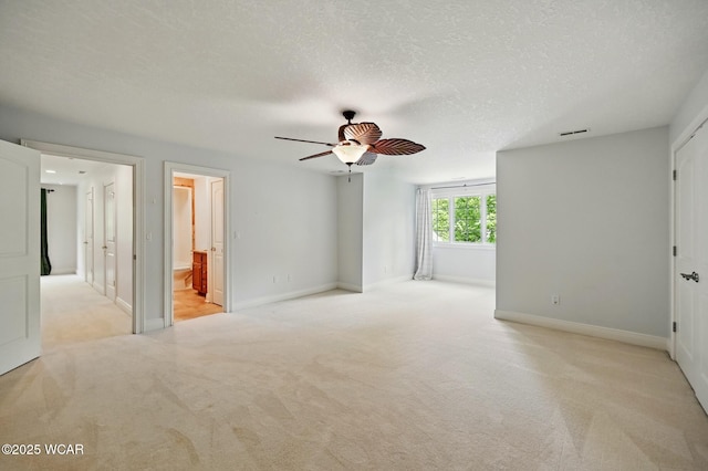 7 Estate Dr, Lima, OH 45805 - unfurnished bedroom featuring light carpet, baseboards, a textured ceiling, ensuite bath, and ceiling fan