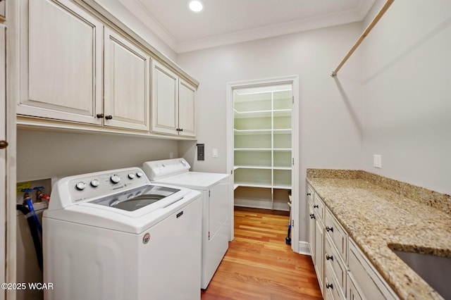 7 Estate Dr, Lima, OH 45805 - washroom featuring washer and dryer, cabinet space, light wood-style floors, crown molding, and recessed lighting
