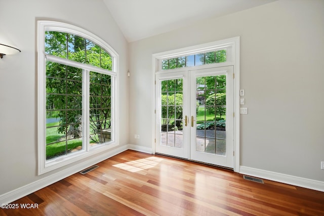 7 Estate Dr, Lima, OH 45805 - doorway featuring plenty of natural light, french doors, vaulted ceiling, wood finished floors, and baseboards