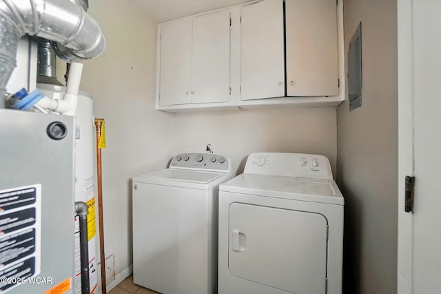 642 Meadowbrook Dr, Lima, OH 45801 - laundry room featuring washer and clothes dryer, cabinet space, gas water heater, and electric panel