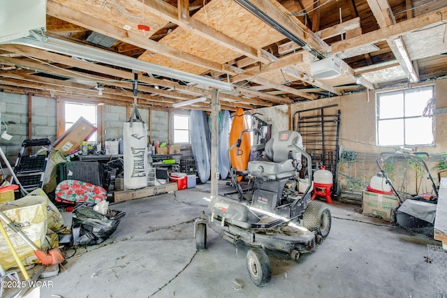 garage with a garage door opener and gas water heater