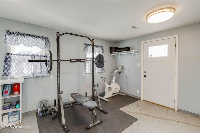 workout room featuring plenty of natural light