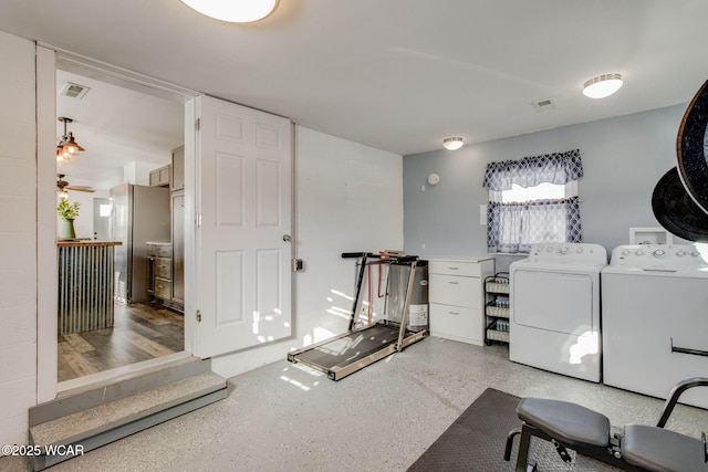 interior space with washing machine and dryer and ceiling fan