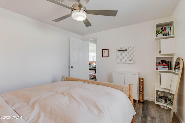 bedroom featuring dark hardwood / wood-style flooring and ceiling fan