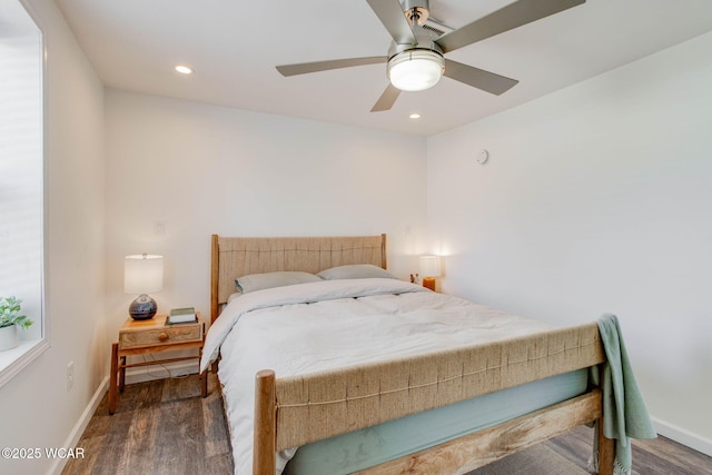 bedroom with dark wood-type flooring and ceiling fan