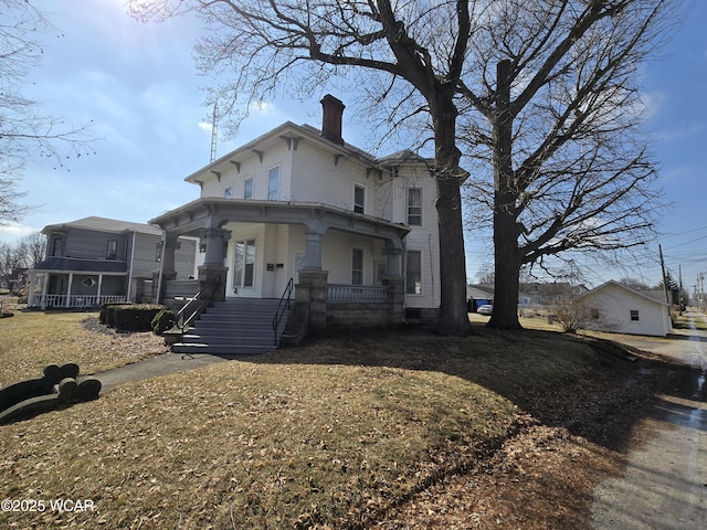 italianate house with covered porch and a chimney