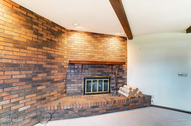 unfurnished living room with a fireplace, brick wall, beam ceiling, and concrete flooring