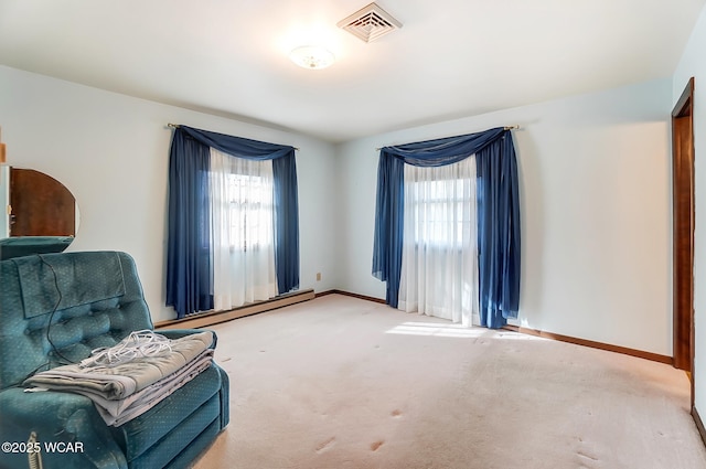 living area with a baseboard radiator and carpet