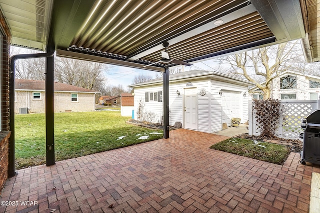 view of patio featuring cooling unit, a garage, an outbuilding, and grilling area