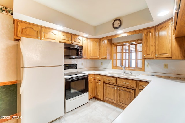 kitchen with sink and white appliances