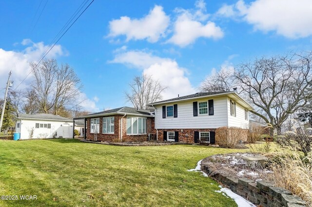 split level home featuring a front lawn