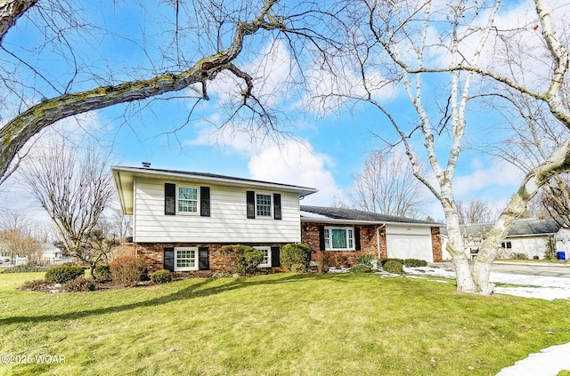 split level home featuring a garage and a front yard