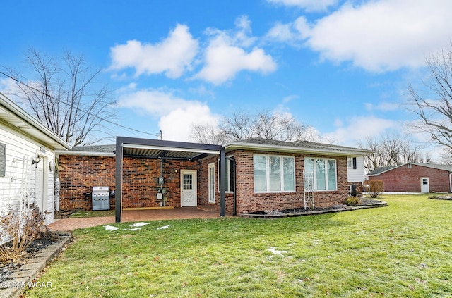 rear view of property with a lawn