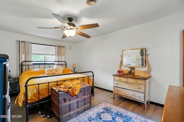 718 Wildwood Ave, Lima, OH 45807 - bedroom with wood finished floors, baseboards, and a ceiling fan