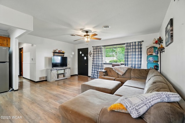 718 Wildwood Ave, Lima, OH 45807 - living area featuring light wood-type flooring, a ceiling fan, and baseboards