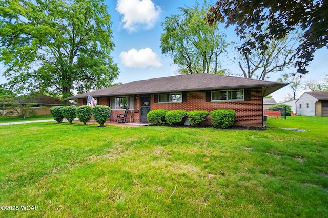 718 Wildwood Ave, Lima, OH 45807 - single story home featuring brick siding and a front lawn