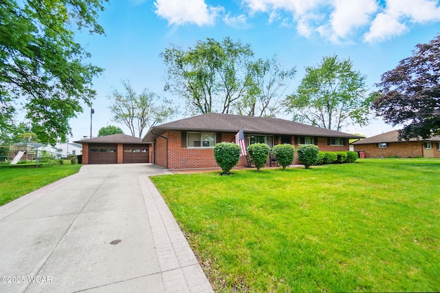 718 Wildwood Ave, Lima, OH 45807 - single story home with brick siding, a front lawn, concrete driveway, and a playground