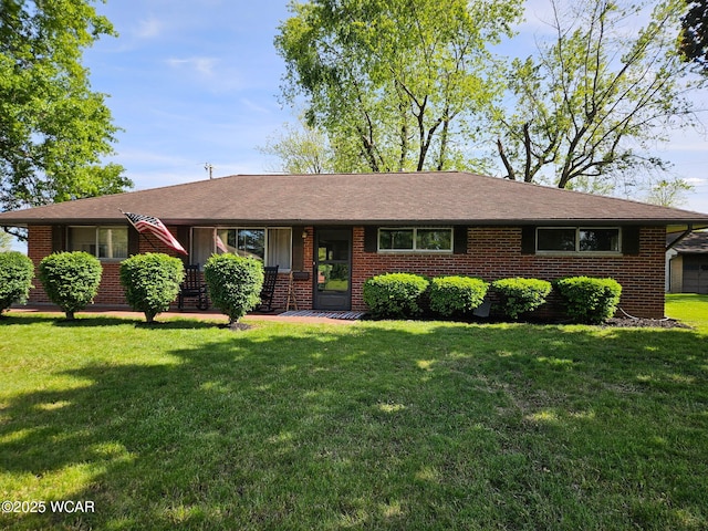 718 Wildwood Ave, Lima, OH 45807 - ranch-style house with brick siding and a front yard