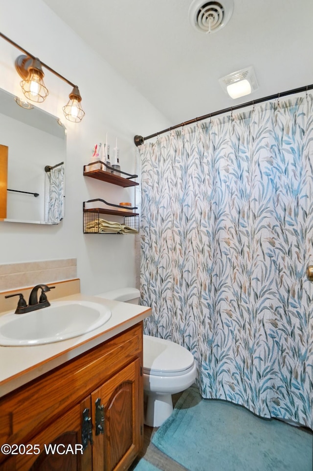 718 Wildwood Ave, Lima, OH 45807 - full bathroom featuring toilet, vanity, and a shower with shower curtain