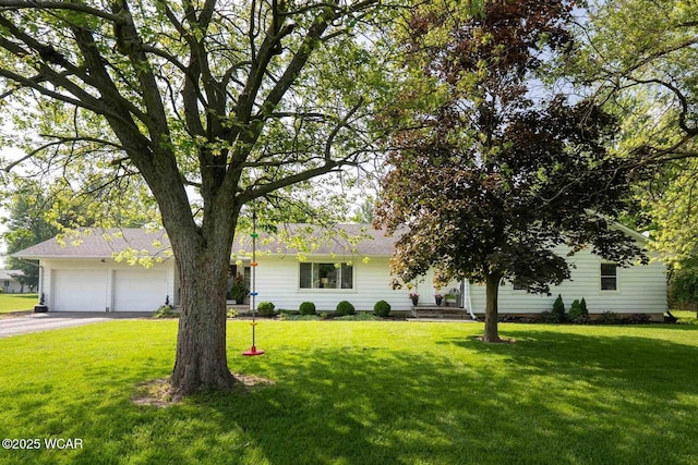 9826 State Route 65, Ottawa, OH 45875 - view of front of home featuring asphalt driveway, an attached garage, and a front yard