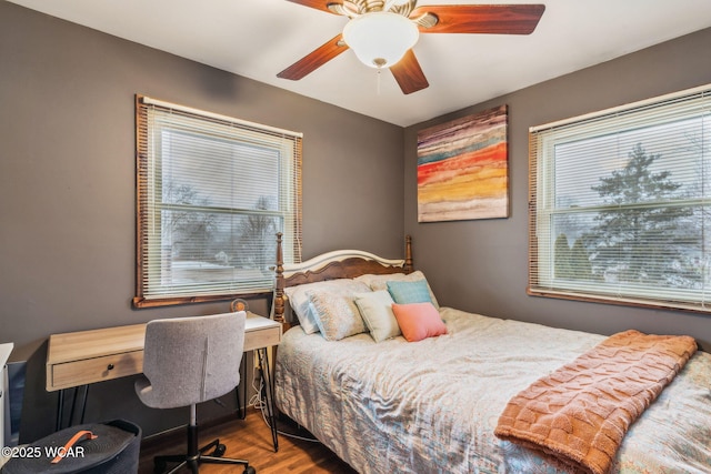 bedroom with hardwood / wood-style flooring and ceiling fan