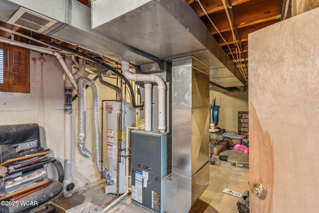 utility room featuring heating unit and gas water heater