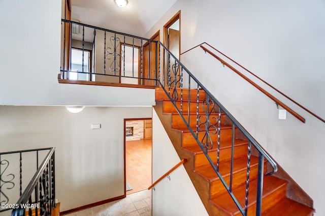 stairway with a towering ceiling