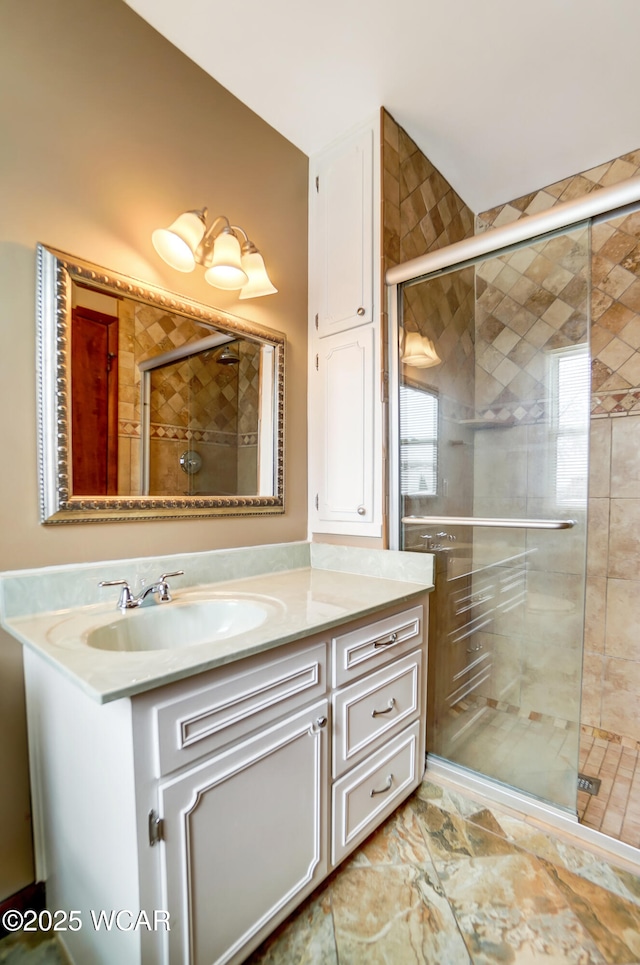 bathroom featuring vanity and a shower stall