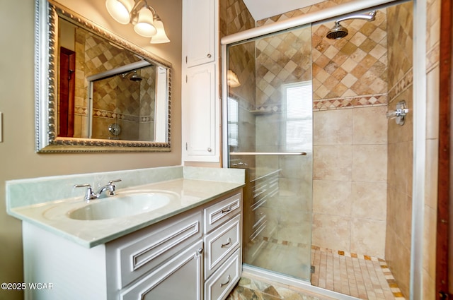 bathroom featuring a shower stall and vanity