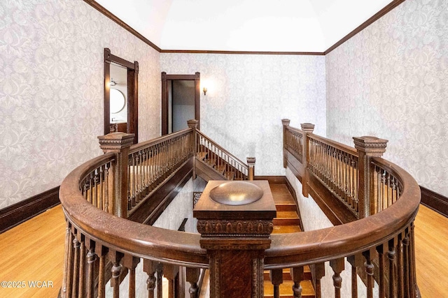 interior space featuring crown molding and hardwood / wood-style flooring