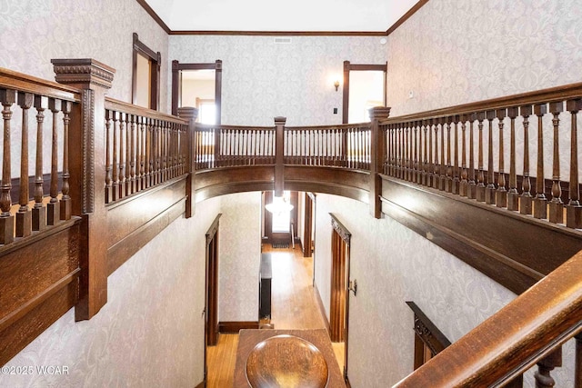 interior space featuring hardwood / wood-style floors and crown molding