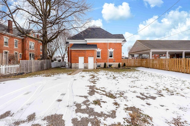 view of snow covered house