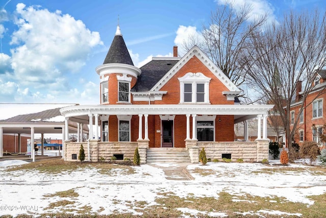 victorian-style house featuring covered porch