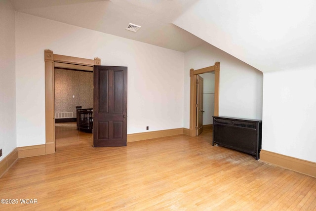 empty room with hardwood / wood-style floors