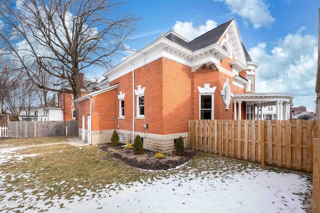 snow covered property featuring a pergola