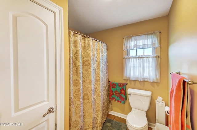 full bath featuring toilet and tile patterned floors