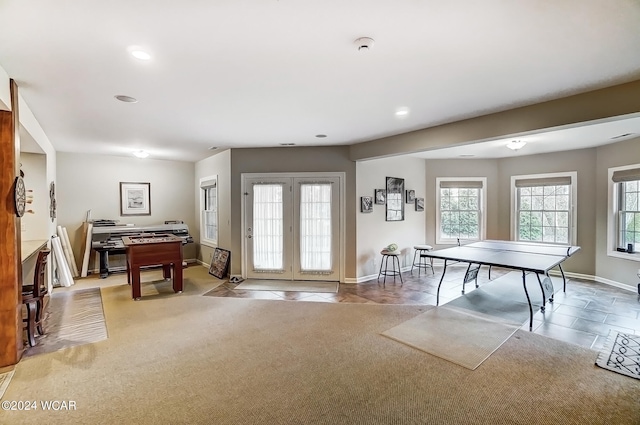 recreation room featuring light tile patterned floors, recessed lighting, baseboards, and light colored carpet