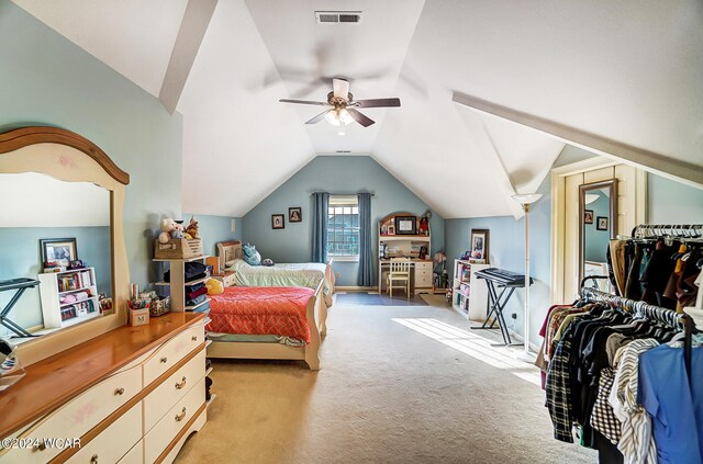 bedroom featuring light carpet, visible vents, vaulted ceiling, and a ceiling fan