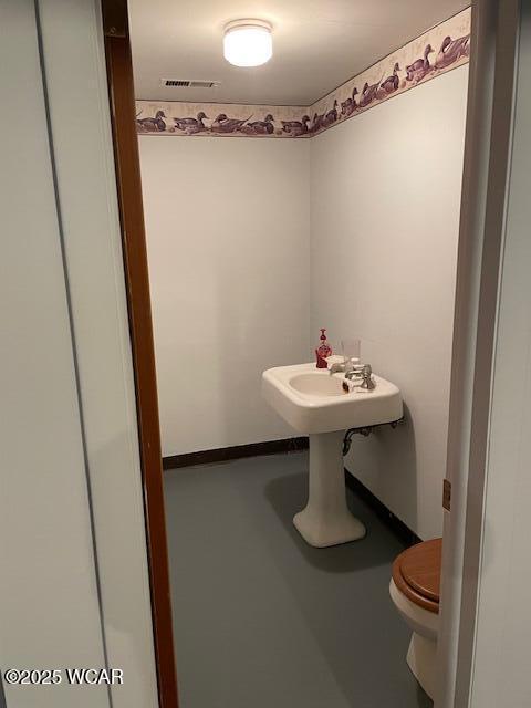 bathroom featuring toilet