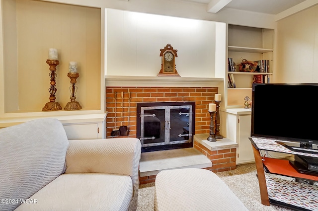 carpeted living room with beamed ceiling, a fireplace, and built in features