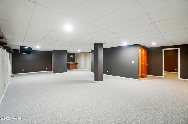 411 Ethan Cir, Bluffton, OH 45817 - finished below grade area featuring carpet flooring, a paneled ceiling, baseboards, and recessed lighting