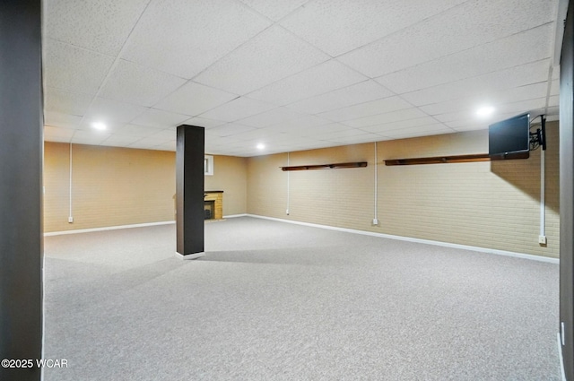 411 Ethan Cir, Bluffton, OH 45817 - finished basement with baseboards, a paneled ceiling, carpet, and a fireplace