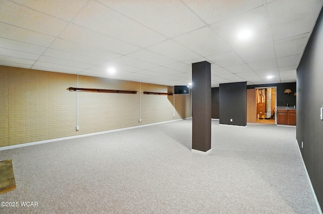 411 Ethan Cir, Bluffton, OH 45817 - finished below grade area with baseboards, a drop ceiling, and carpet floors