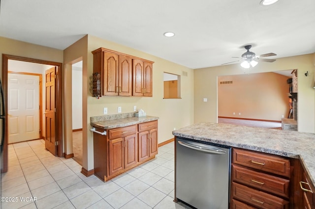 411 Ethan Cir, Bluffton, OH 45817 - kitchen with dishwasher, light countertops, a ceiling fan, baseboards, and light tile patterned floors