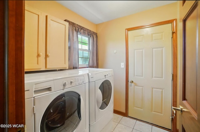411 Ethan Cir, Bluffton, OH 45817 - washroom with washing machine and clothes dryer, light tile patterned flooring, and cabinet space