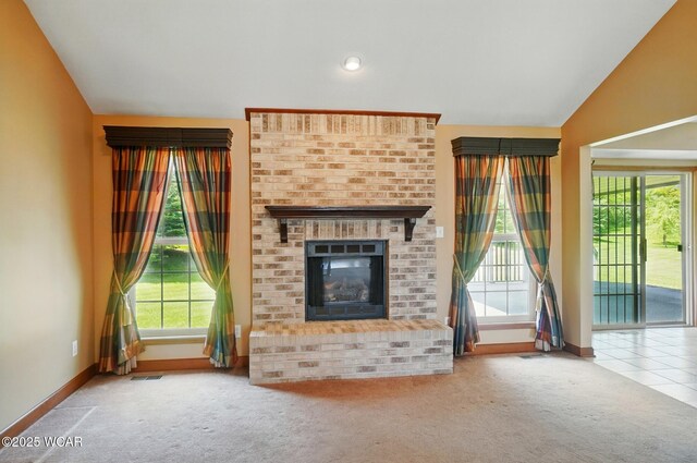 411 Ethan Cir, Bluffton, OH 45817 - unfurnished living room featuring carpet, a brick fireplace, baseboards, and vaulted ceiling