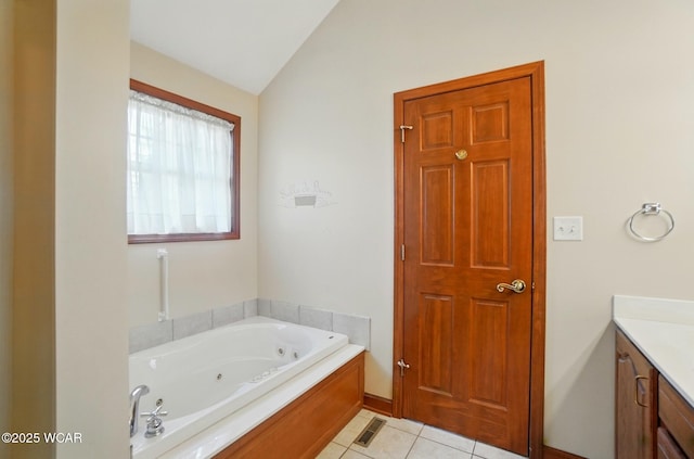 411 Ethan Cir, Bluffton, OH 45817 - full bath with vanity, lofted ceiling, a tub with jets, and tile patterned floors
