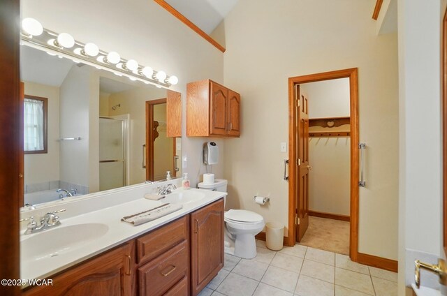 411 Ethan Cir, Bluffton, OH 45817 - full bathroom with a stall shower, double vanity, a garden tub, toilet, and tile patterned floors