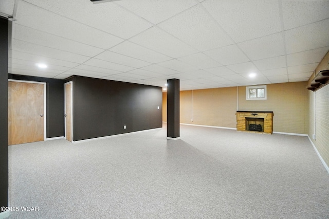 411 Ethan Cir, Bluffton, OH 45817 - below grade area with baseboards, a fireplace, and a paneled ceiling