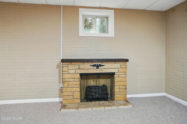 411 Ethan Cir, Bluffton, OH 45817 - detailed view of a fireplace with raised hearth, carpet floors, and baseboards